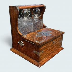 A Late Victorian Period Oak Tantalus Games Compendium