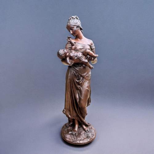 A Finely Cast Bronze Figure depicting a Mother with Cherub image-1