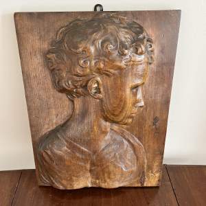 An Oak High Relief Carved Portrait of Young Lady signed Wagner