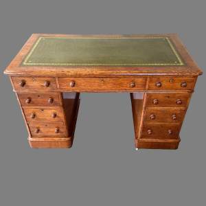 A Victorian Oak Rounded Corner Pedestal Desk