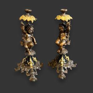 Late 19th Century Pair of Putti Decor Candlesticks