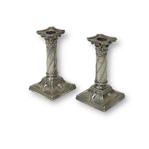 A Matched Pair of Silver Candlesticks by Edward Hutton of London image-1