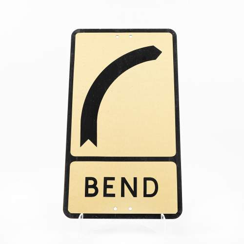 A Vintage Metal Road Sign for a Bend Ahead image-1