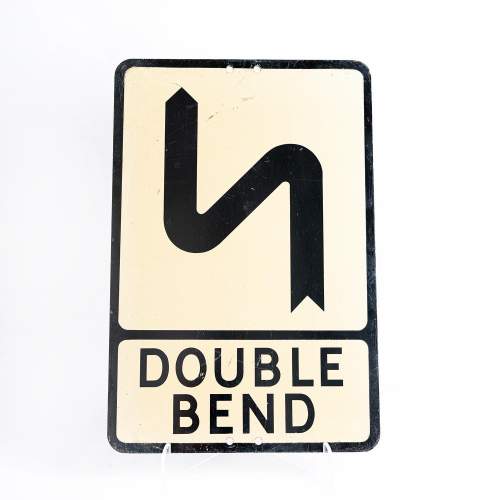 A Vintage Metal Road Sign for a Double Bend Ahead image-1